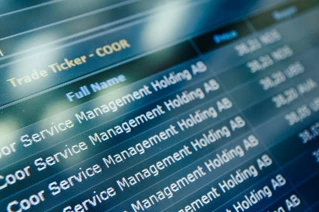 Close up photo of a screen showing stock information.
