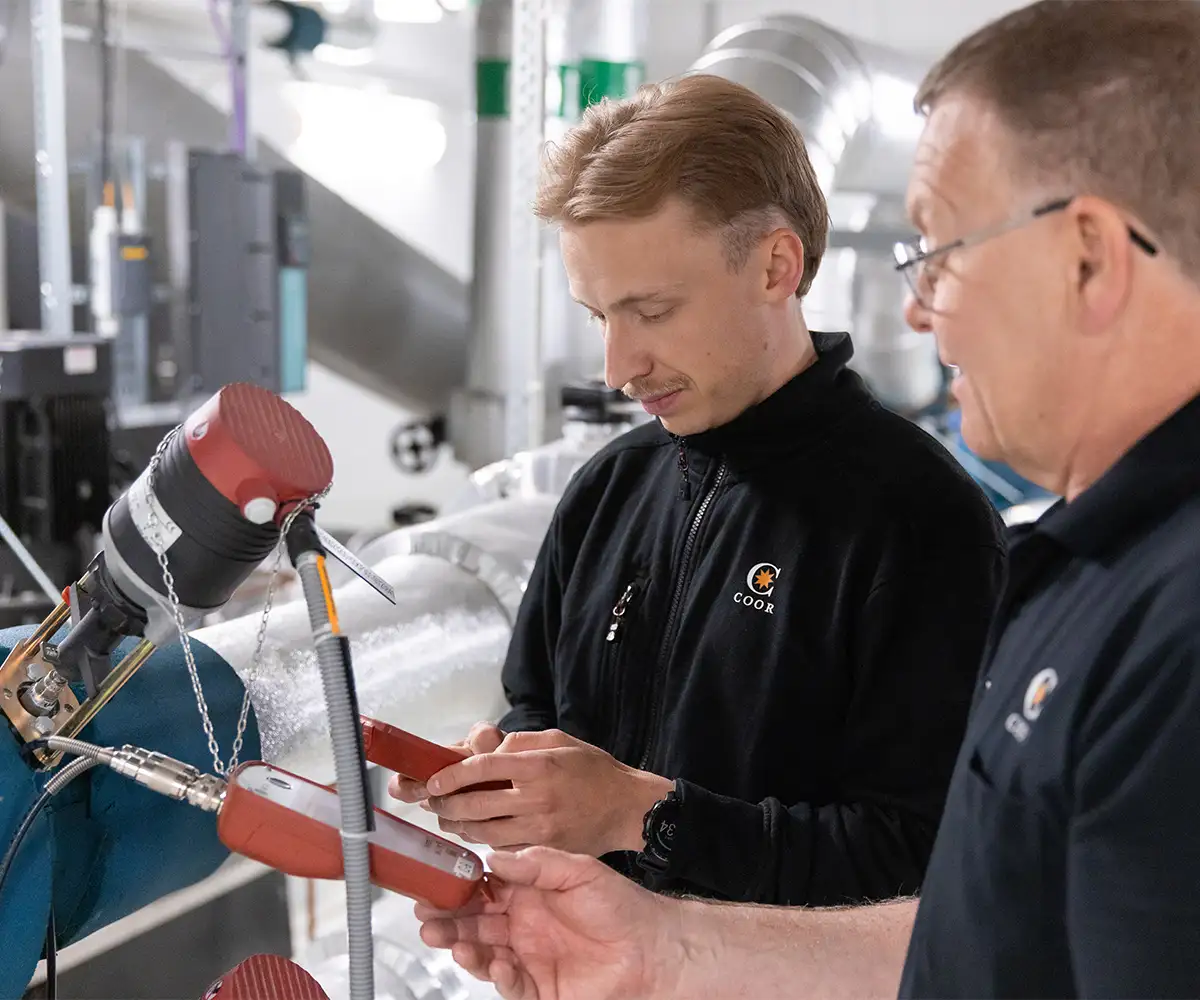 Property technicians inspecting machinery 
