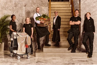 A group of different service employees dressed in uniform.