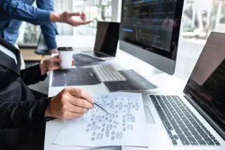 People working by computers.