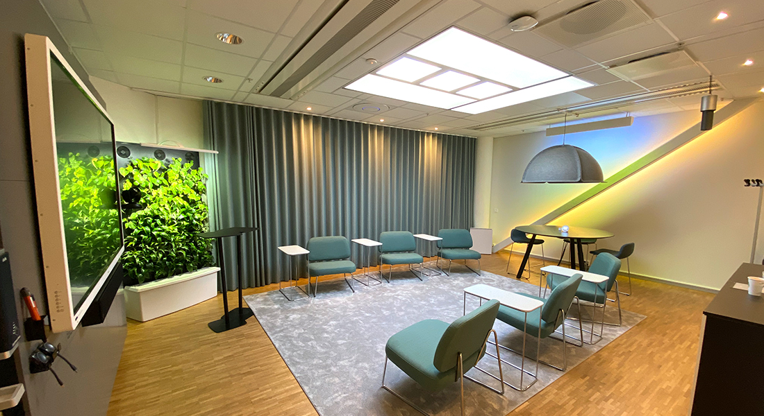 A modern meeting room with an artificial skylight.