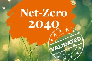 Green meadow in sunlight with an orange splash with the text Net-Zero 2040 validated